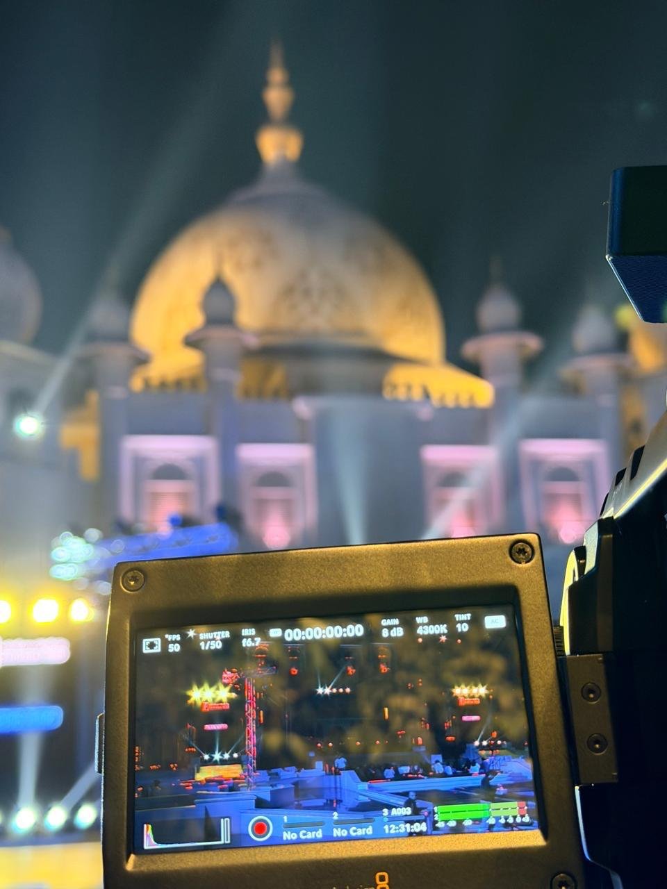 Broadcast camera filming a night event