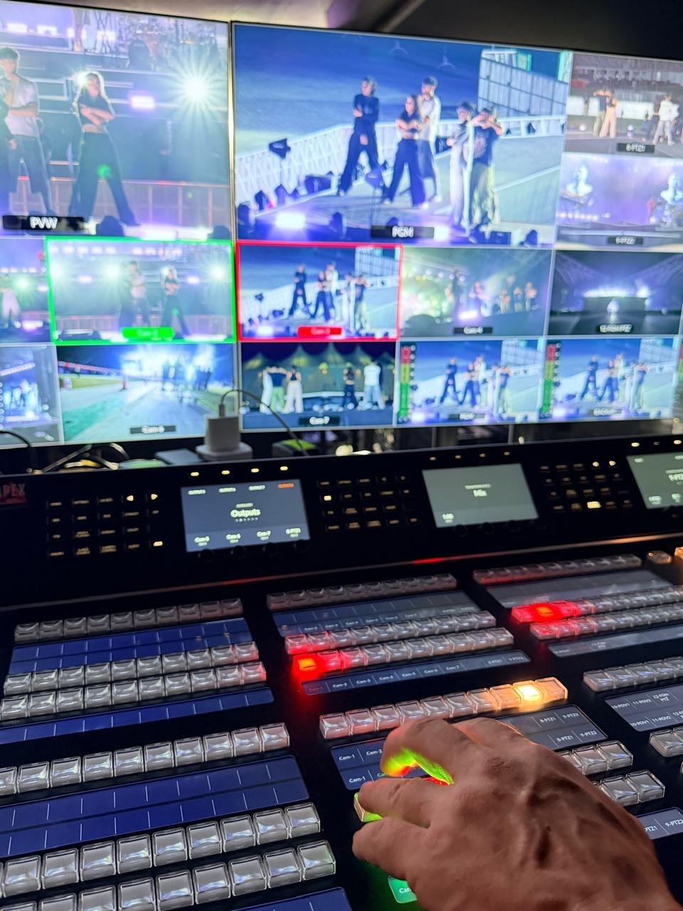 Apex technical director operating a live production switcher