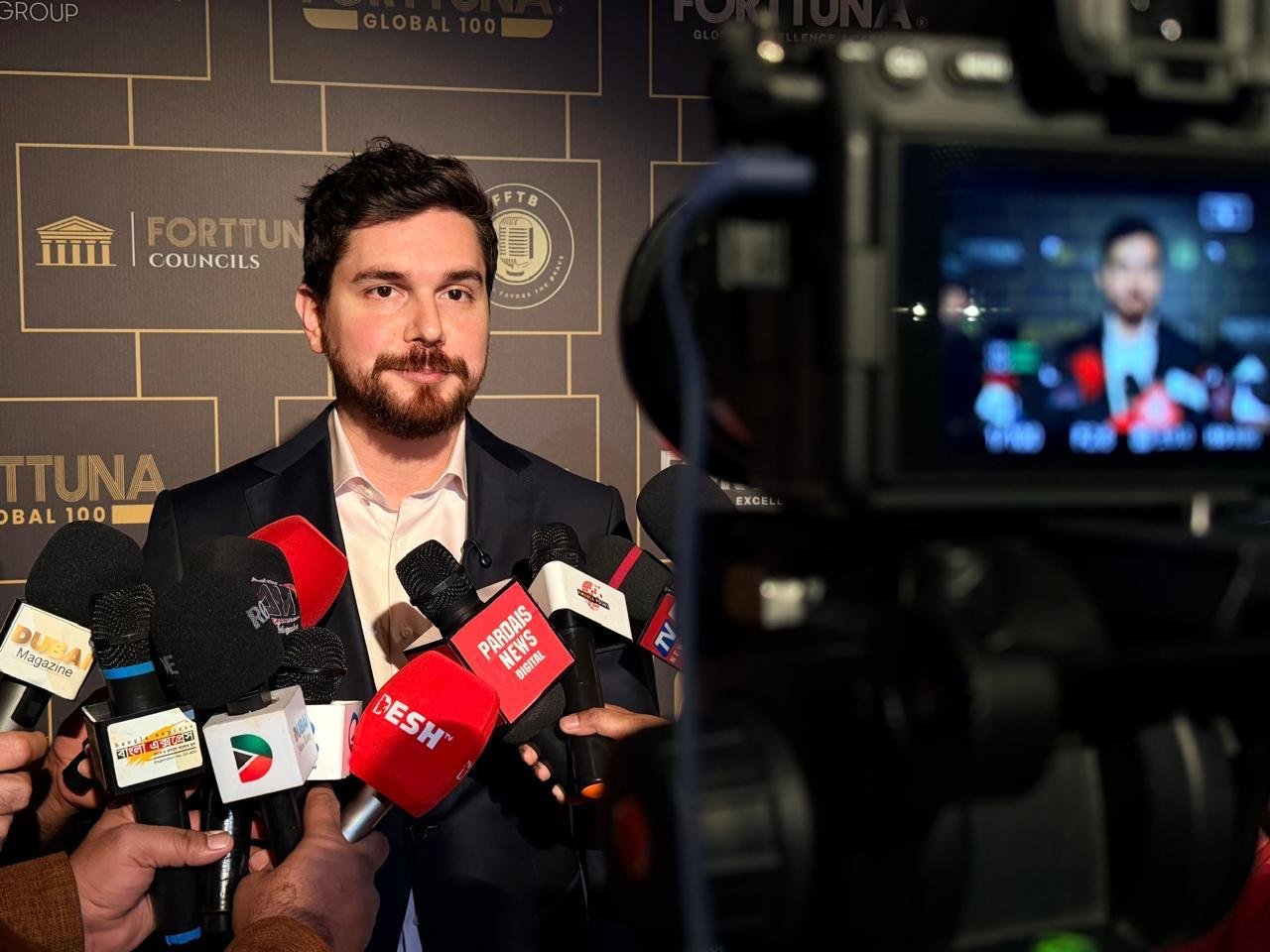Press interview filmed by a broadcast camera