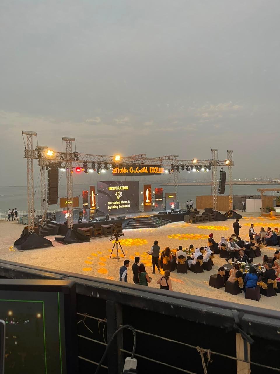 Outdoor waterfront awards stage and audience